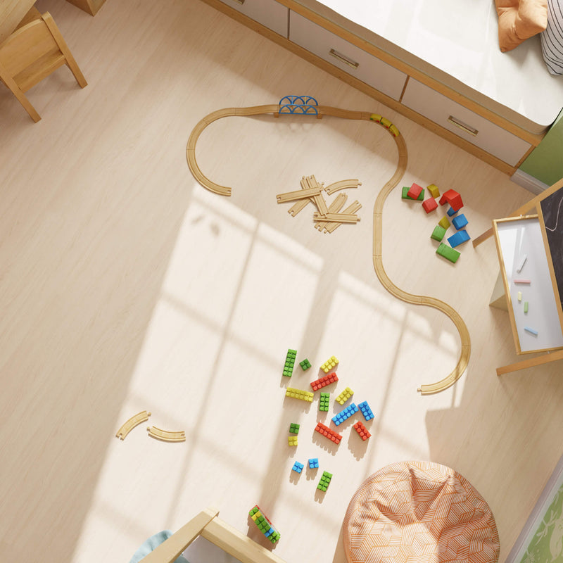 Wooden toy train set on a Waterblock X Yagu warm brown floor with colorful blocks.