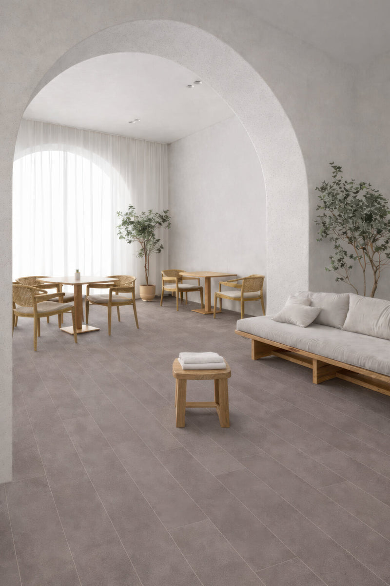 Modern commercial interior with Waterblock X Horu light taupe stone-look floor, wooden furniture, and white walls.