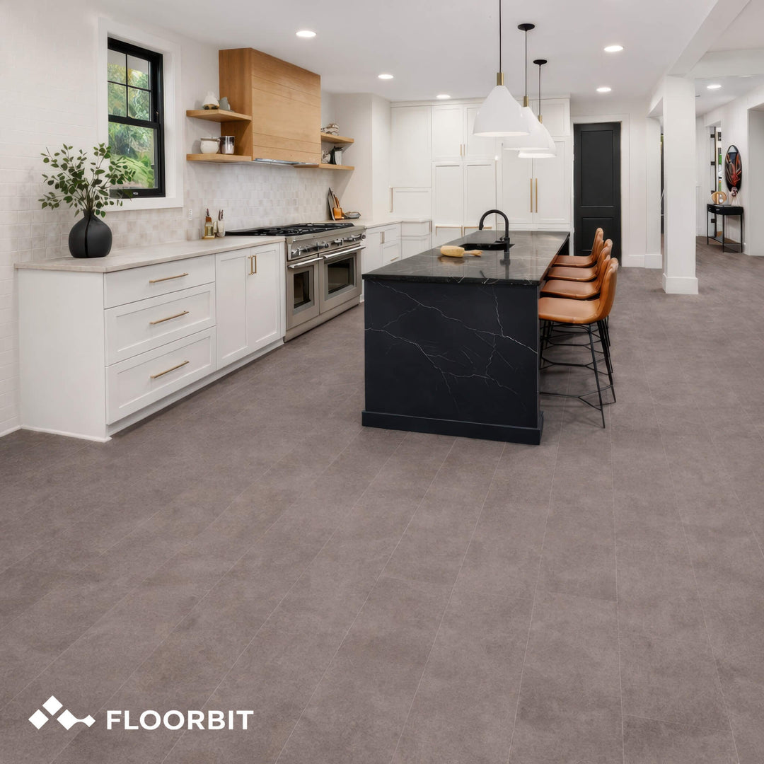 Modern kitchen with Waterblock X Horu light taupe stone-look floor, white cabinets, and black island.