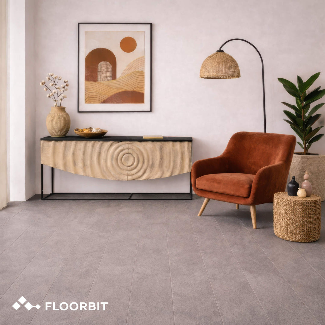 Modern living room with a brown armchair, console table, and abstract art on a Waterblock X Horu light taupe stone-look floor.