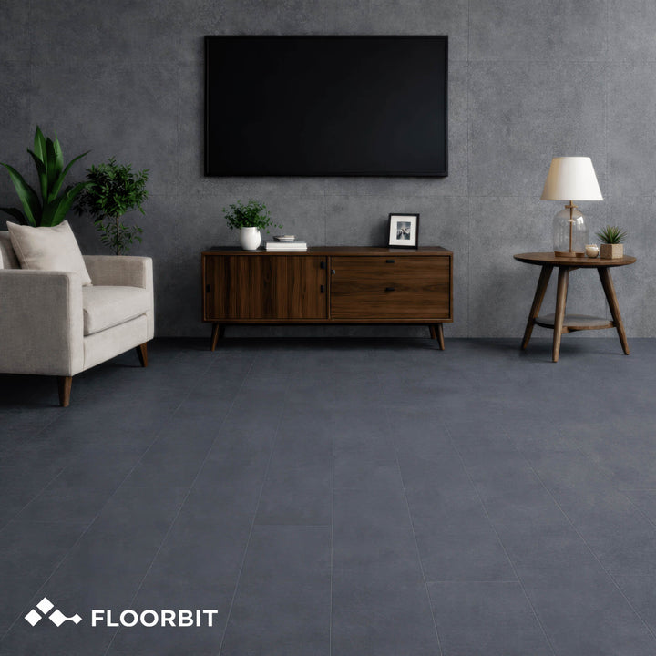 Modern living room with Waterblock X Joku dark grey stone-look floor, furniture, and a television.
