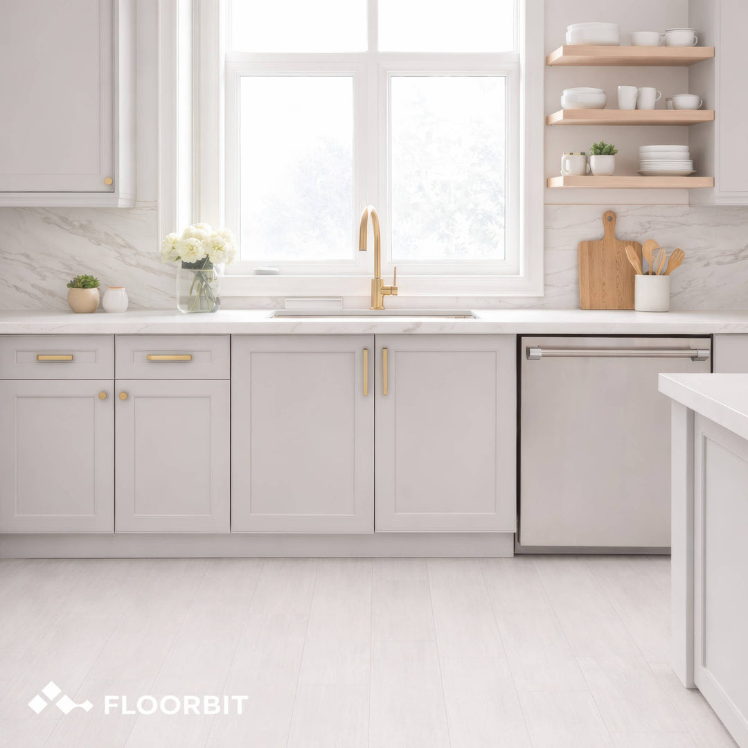 Modern kitchen with Waterblock X Mizu light brown floor, light gray cabinets, white countertops, and a window above the sink.