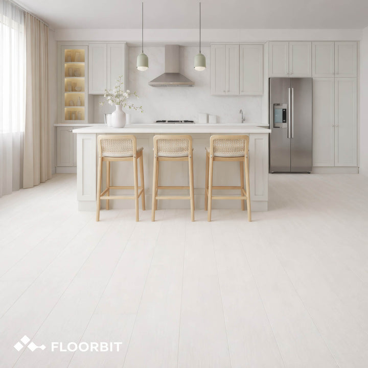 Modern kitchen with Waterblock X Mizu light brown floor, white cabinets, island, and stools, featuring the FLOORBIT logo.