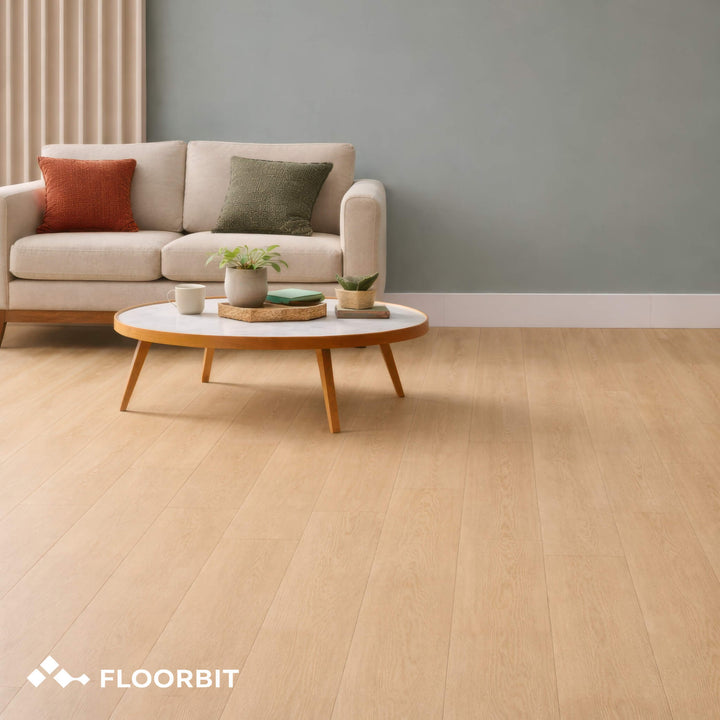 Living room with beige sofa, coffee table, and decorative items on a Waterblock X Yagu brown floor. FLOORBIT logo visible.